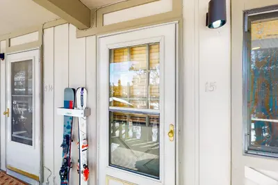 a door to a building with skis in it at Hi Country Haus Haven in Winter Park