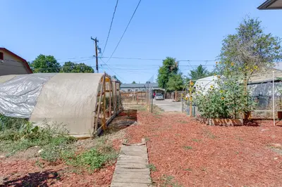 a garden with a fence and some plants at 7 Mi to Denver Inviting Aurora Home with Yard! in Aurora
