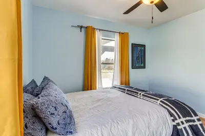 a bedroom with a bed and a window at 7 Mi to Denver Inviting Aurora Home with Yard! in Aurora