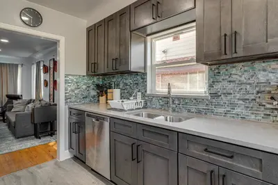 a kitchen with a sink and a counter top at 7 Mi to Denver Inviting Aurora Home with Yard! in Aurora