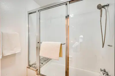a shower with a glass door in a bathroom at 10 Mi to Denver Pet-Friendly Arvada Home with Yard! in Arvada