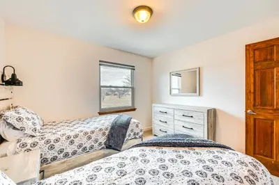 a bedroom with two beds and a window at 10 Mi to Denver Pet-Friendly Arvada Home with Yard! in Arvada
