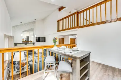 a kitchen and dining room with a table and chairs at 10 Mi to Denver Pet-Friendly Arvada Home with Yard! in Arvada