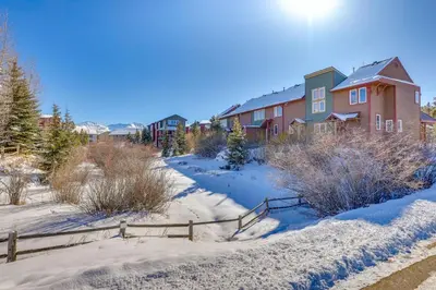 a row of houses in the snow at Fantastic Fraser Condo Year-Round Family Getaway in Fraser