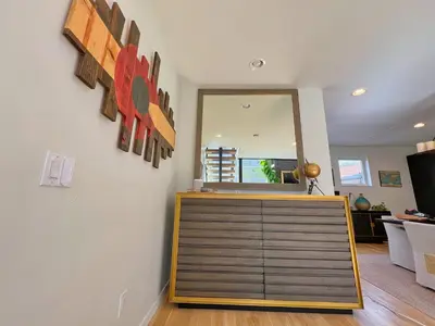 a room with a door and a mirror on a wall at Modern Luxury Home I Sleeps 8 I 10min to Downtown in Denver
