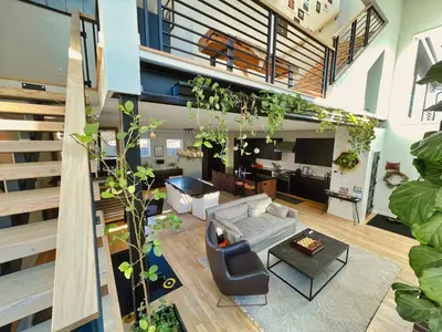 a living room with a lot of plants at Modern Luxury Home I Sleeps 8 I 10min to Downtown in Denver