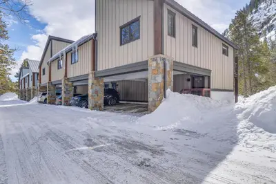 a building with a pile of snow in front of it at Downtown Frisco Townhome about 1 Mi to Lake Dillon! in Frisco