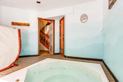 a bath tub in a room with a doorway at Downtown Frisco Townhome about 1 Mi to Lake Dillon! in Frisco