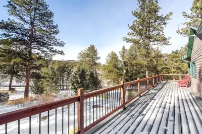 a wooden deck with a bench on it at Skipper's Cabin in Pine