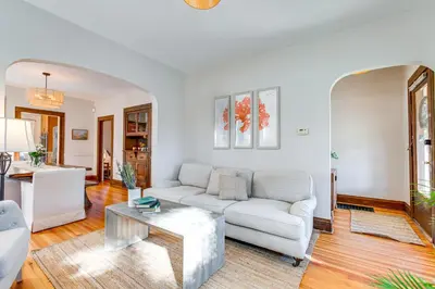 a living room with a couch and a table at 4 Mi to Downtown Denver Washington Park Hideaway! in Denver