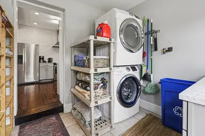 a laundry room with a washer and dryer at 5-Bedroom Victorian Home Private Yard Sleeps 10 in Denver