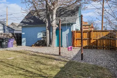 a batting cage in front of a house at 5-Bedroom Victorian Home Private Yard Sleeps 10 in Denver