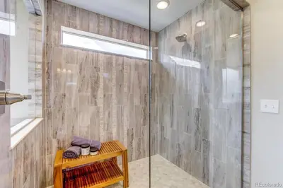 a bathroom with a shower with a glass door at Stunning Golf Course View in Denver in Denver