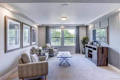 a living room with two chairs and a table at Stunning Golf Course View in Denver in Denver