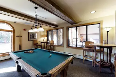 a billiard room with a pool table in it at Red Hawk Lodge 2 Bedroom Condo In River Run Village in Keystone