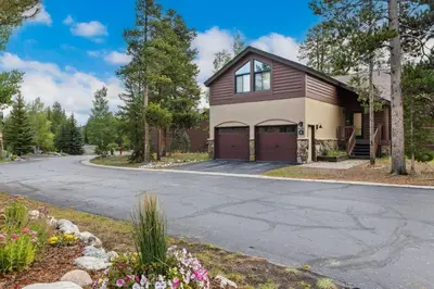 a house on a street with a driveway at WaterDance #475A in Frisco