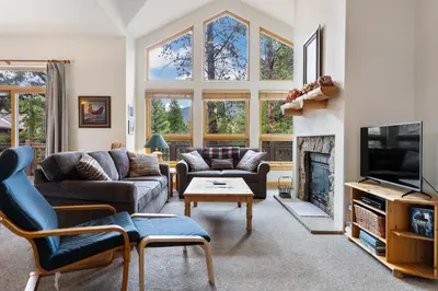a living room with a couch and a tv at WaterDance #475A in Frisco