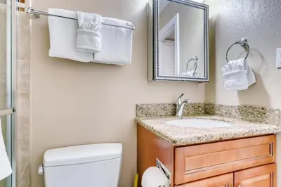 a bathroom with a sink and a mirror at Mountainside #272H in Frisco