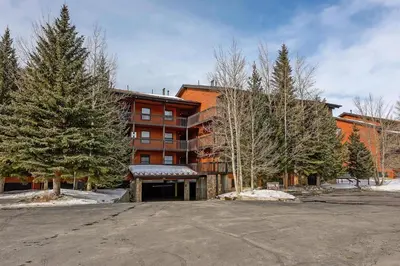 a large building with trees in front of it at Mountainside #272H in Frisco