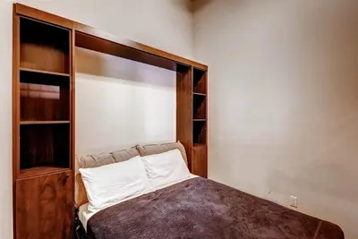 a bedroom with a bed and a book shelf at Boulevard Bend P2 in Frisco