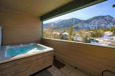 a jacuzzi tub in a room with a large window at Boulevard Bend P2 in Frisco