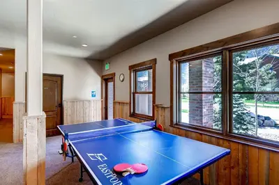 a blue ping pong table in a room at Boulevard Bend P2 in Frisco