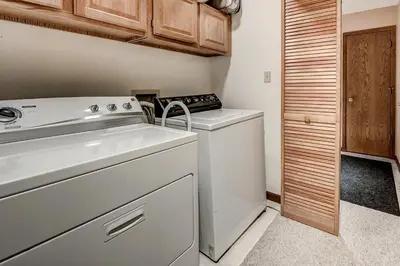 a small kitchen with a stove and a dishwasher at Pitkin Townhome 704 in Frisco