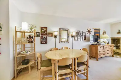 a dining room with a table and chairs at Cedar Lodge 309 in Frisco