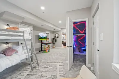 a bedroom with a bunk bed and a hallway at Whispering Pines-Hot tub Getaway in Bailey