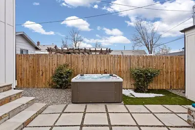 a backyard with a hot tub in the yard at Luxury Home: Monthly Rental House Near Denver in Englewood