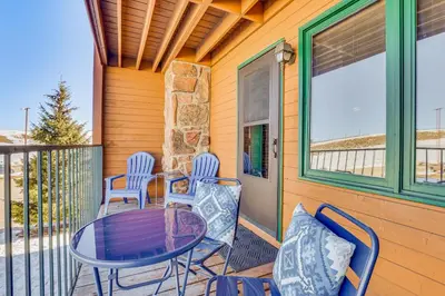 a patio with a table and chairs on a house at 2 Mi to Granby Ranch Dog-Friendly Studio! in Granby