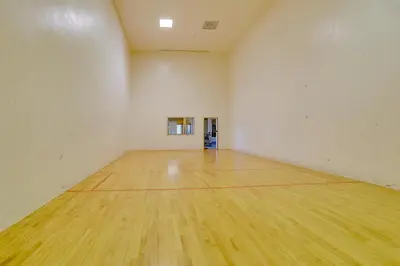 an empty gym with a wooden floor in a room at 2 Mi to Granby Ranch Dog-Friendly Studio! in Granby