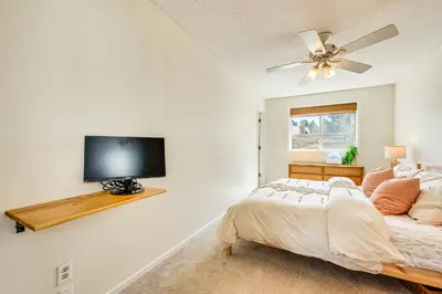 a bedroom with a bed and a flat screen tv at Fraser Condo with Ski Shuttle and Resort Amenities! in Fraser