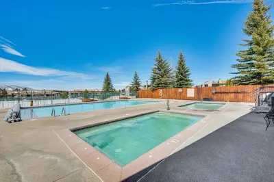 a swimming pool in the middle of a yard at Fraser Condo with Ski Shuttle and Resort Amenities! in Fraser