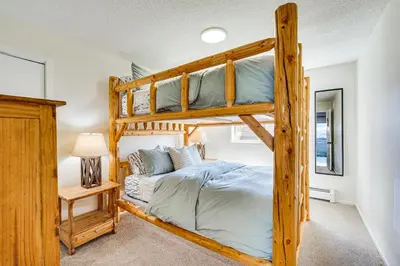 a bedroom with two bunk beds in a house at Fraser Condo with Ski Shuttle and Resort Amenities! in Fraser