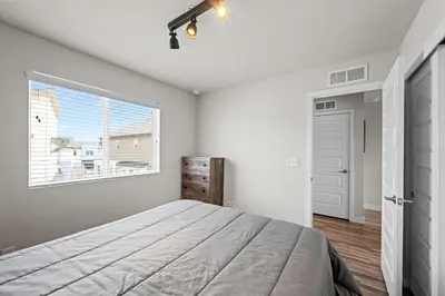a bedroom with a large bed and a window at Uptown Avenue - Broomfield in Broomfield