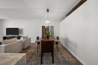 a dining room with a table and a couch at Spire - Unit 1810 in Denver