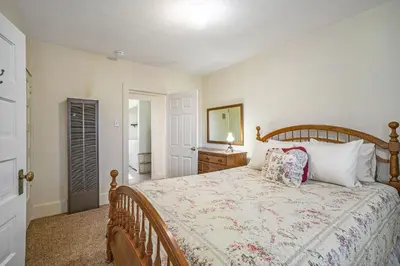a bedroom with a bed and a dresser and a mirror at O'Deer Cabin - Pet Friendly - Estes Park -- EV#3241 cabin in Estes Park