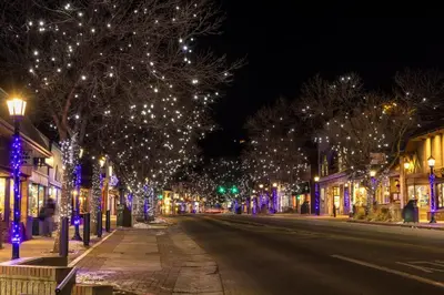 a city street with christmas lights on trees at O'Deer Cabin - Pet Friendly - Estes Park -- EV#3241 cabin in Estes Park