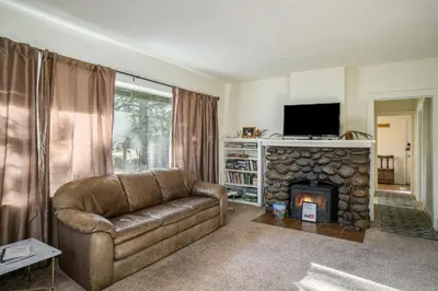 a living room with a couch and a fireplace at O'Deer Cabin - Pet Friendly - Estes Park -- EV#3241 cabin in Estes Park