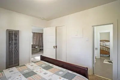 a bedroom with a bed and a living room at O'Deer Cabin - Pet Friendly - Estes Park -- EV#3241 cabin in Estes Park