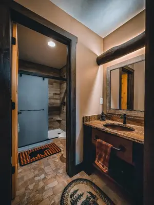 a bathroom with a sink and a mirror at Eldondale -- 22-ZONE3272 home in Estes Park