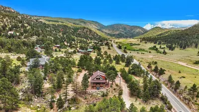 an aerial view of a house in the mountains at Eldondale -- 22-ZONE3272 home in Estes Park