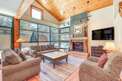 a living room with two couches and a fireplace at Keystone Ski House Gem Walk to River Run Gondola! in Keystone