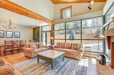 a living room with two couches and a table at Keystone Ski House Gem Walk to River Run Gondola! in Keystone