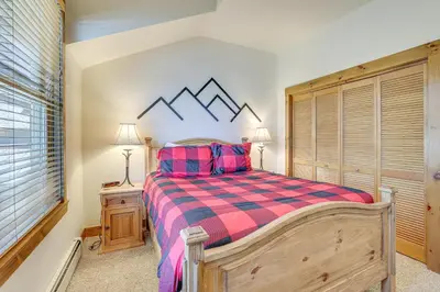 a bedroom with a large bed and a window at Keystone Ski House Gem Walk to River Run Gondola! in Keystone