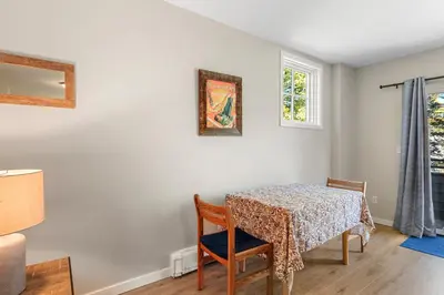 a dining room with a table and chairs and a window at Alpine Ridge A25 by Great Western Lodging in Dillon
