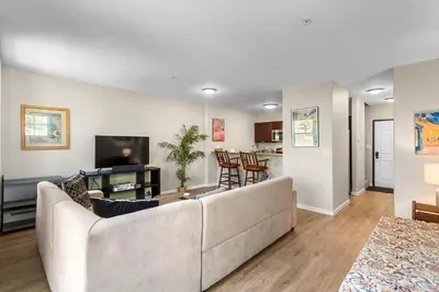 a living room with a couch and a tv at Alpine Ridge A25 by Great Western Lodging in Dillon