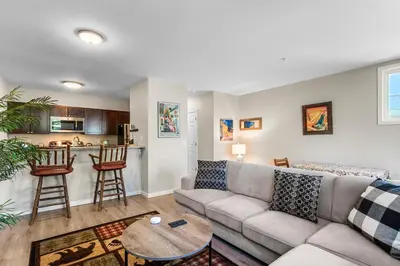 a living room with a couch and a table at Alpine Ridge A25 by Great Western Lodging in Dillon