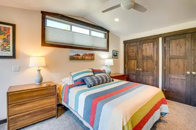 a bedroom with a bed and a window at Walk to Slopes Home with Hot Tub in Keystone in Keystone